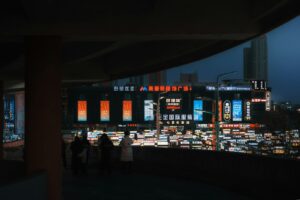 Cityscape at night with bright neon signs